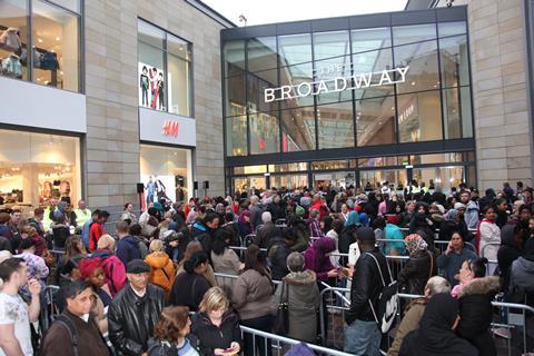 Hundreds of people queue outside The Broadway ahead of its opening on Thursday morning.